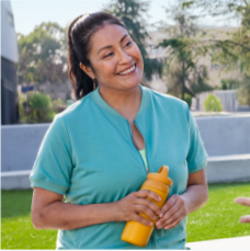 A 43 year old female DUPIXENT® (dupilumab) patient smiling